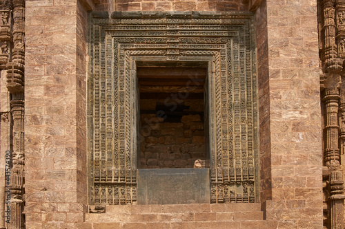 Detail of religious carvings decorating the entrance to the ancient Surya Hindu Temple at Konark Orissa India. 13th Century AD photo