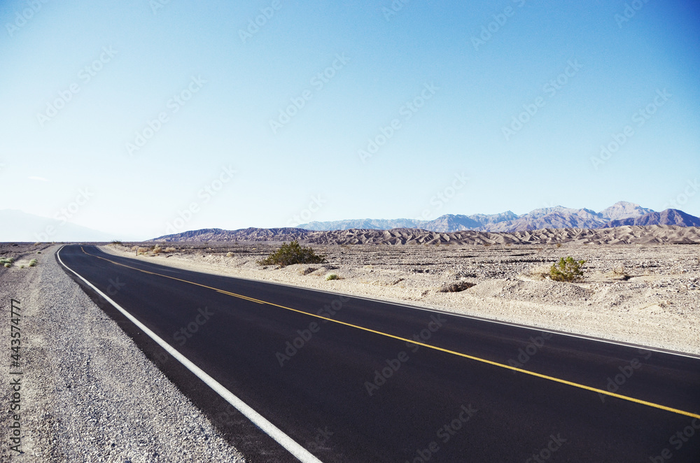 USA, DEATH VALLEY: Scenic landscape view of the desert mountains with the road
