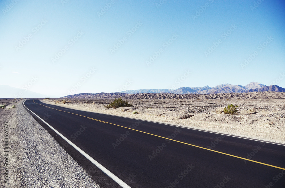 USA, DEATH VALLEY: Scenic landscape view of the desert mountains with the road USA, DEATH VALLEY: Scenic landscape view of the desert mountains with the road