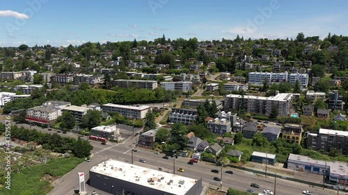 Cinematic 4K aerial drone footage of Interbay, Balmer Yard and the West Queen Anne hillside, upscale, affluent suburbs uptown by Puget Sound, in Seattle, Washington photo