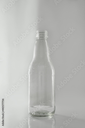 clear glass bottle on white background
