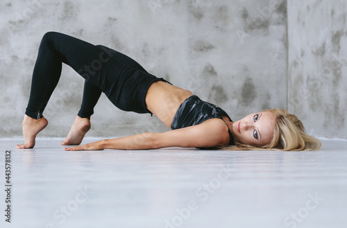 Athlete girl takes a photo session by making various movements