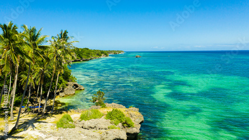 Beautiful tropical beach with white sand, palm trees, turquoise ocean. Bohol, Anda area, Philippines. photo