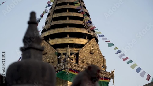 Macaque Monkey At Swayambhunath Stupa (Monkey Temple) In Kathmandu, Nepal. - Tilt-Up Shot photo