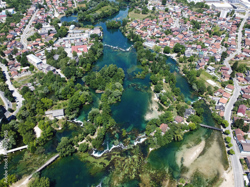 Aerial drone view Bihac and Una river in Bosnia and Herzegovina. Buildings, streets and residential houses. Bihać is a town and municipality in western BiH. photo