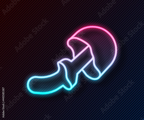 Glowing neon line Psilocybin mushroom icon isolated on black background. Psychedelic hallucination. Vector