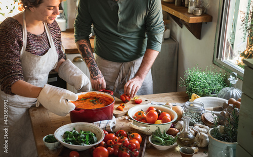 Fényképezés Couple making a tomato soup