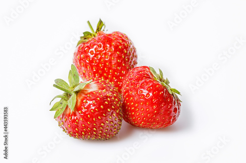 Ripe strawberries on a white background. Sweet red juicy strawberries. Organic food. Copy space. Close up. Seasonal antioxidant and detox nutrient in human health. Top 20 fruits antioxidant capacity