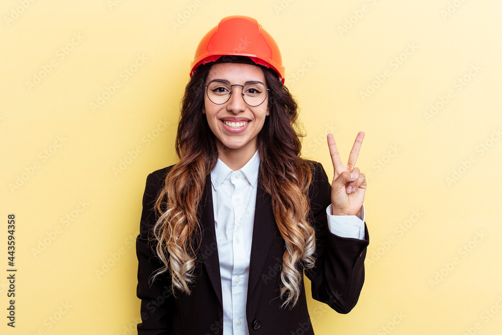 Young architect mixed race woman isolated on yellow background showing number two with fingers.