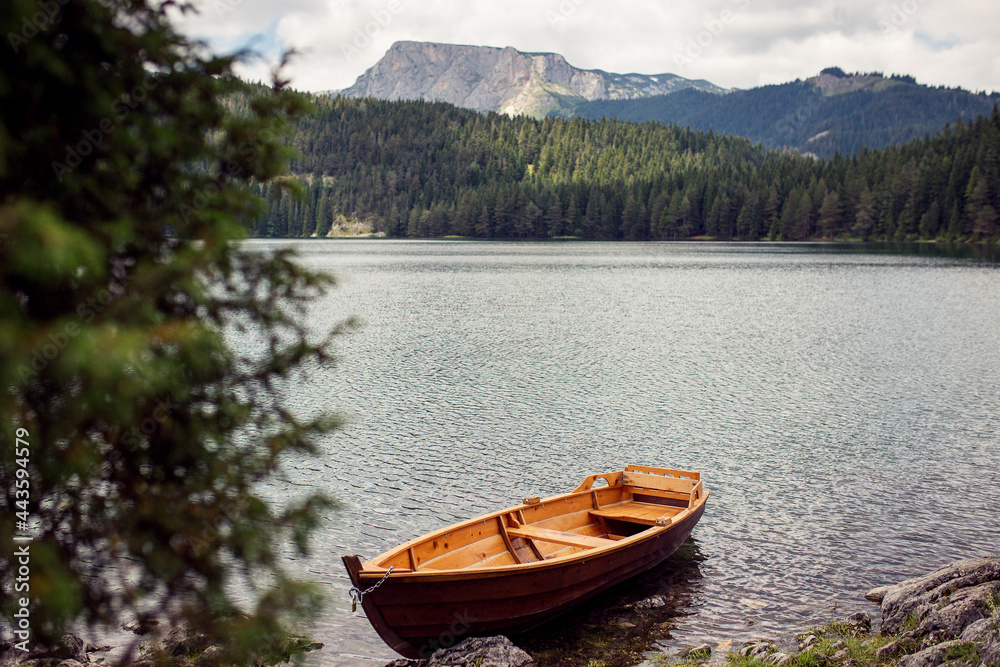 Boat on Black lake in Montenegro Boat on Black lake in Montenegro