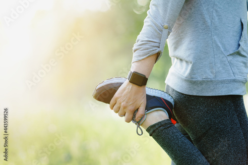 Close Up Of Woman Stretching Before Run