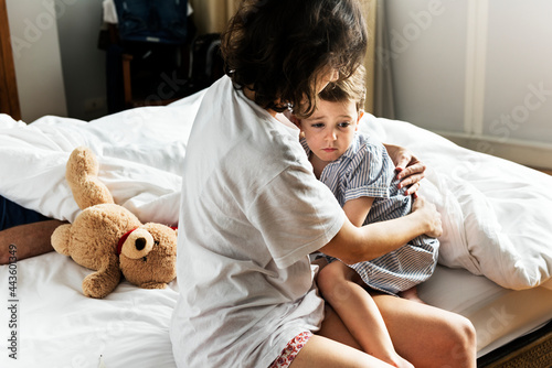 Tablou pe pânză Mother consoling her son from a nightmare