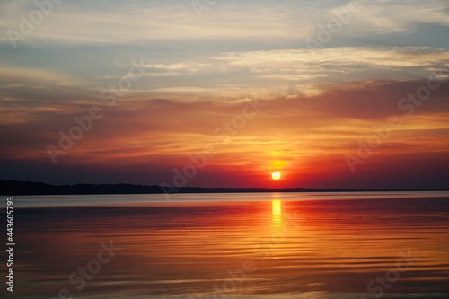 sunset at the beach. sunset in the sea. sunset over the sea. © Oksana