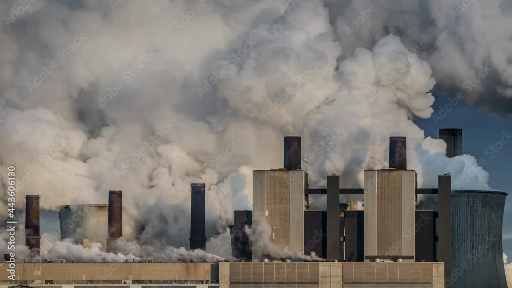 steam rising from the cooling towers of a lignite-fired power plant steam rising from the cooling towers of a lignite-fired power plant