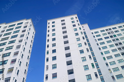 Low Angle View of Modern Buildings against Vivid Blue Sunny Sky © jobi_pro