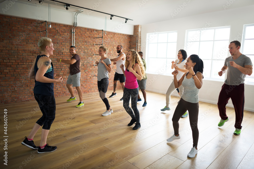 Fototapeta premium Happy diverse people in an active exercise class