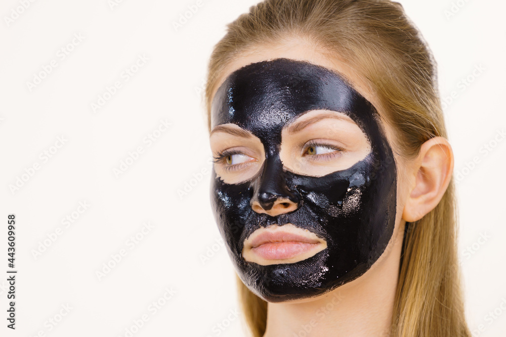 Girl black carbo peel off mask on face Girl black carbo peel off mask on face