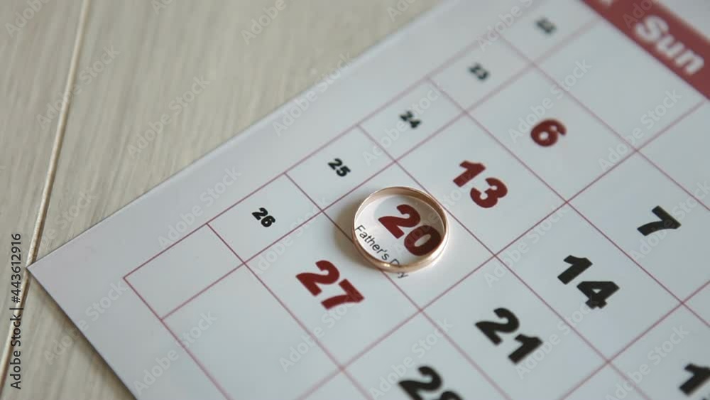 Father Day Sunday 20th.Man puts his wedding ring on the 20th of the calendar. Father Day Sunday 20th.Man puts his wedding ring on the 20th of the calendar.