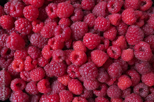 Fresh mouth-watering raspberries. Raspberry background