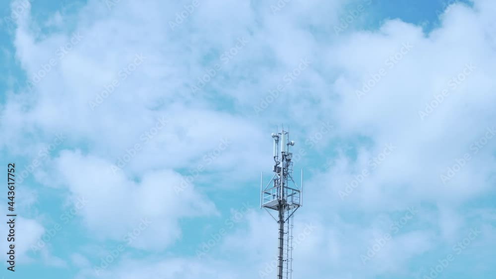 Cellular GSM tower with 3g, 5g Transmitter, Cell Tower, Mobile Communication, Mobile Operator Tower and Beautiful Time Lapse of White Puffy Cumulus Clouds in A Blue Sky in Sunny Weather During The Day Cellular GSM tower with 3g, 5g Transmitter, Cell Tower, Mobile Communication, Mobile Operator Tower and Beautiful Time Lapse of White Puffy Cumulus Clouds in A Blue Sky in Sunny Weather During The Day