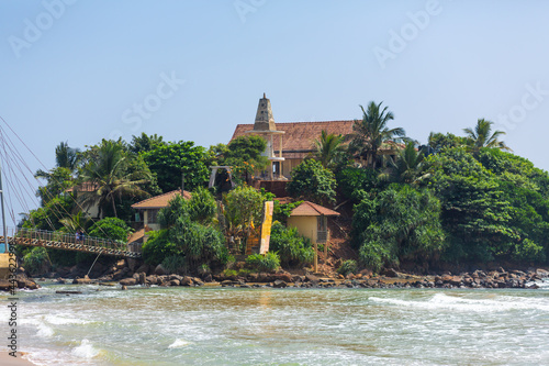 A small island near the beach by the ocean