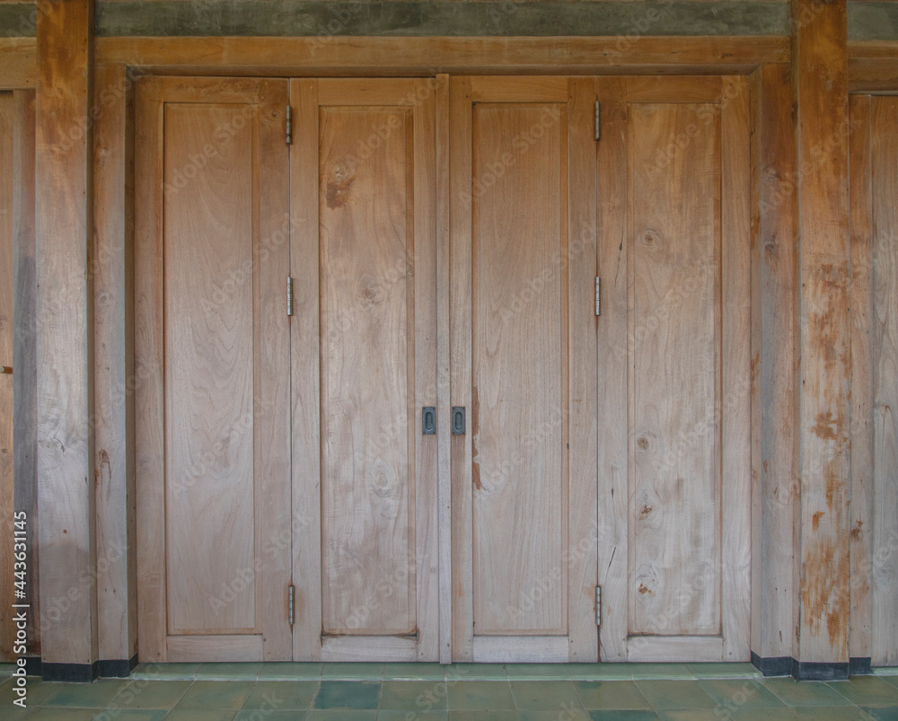 Vintage of old solid wooden folding doors texture. Antique folding