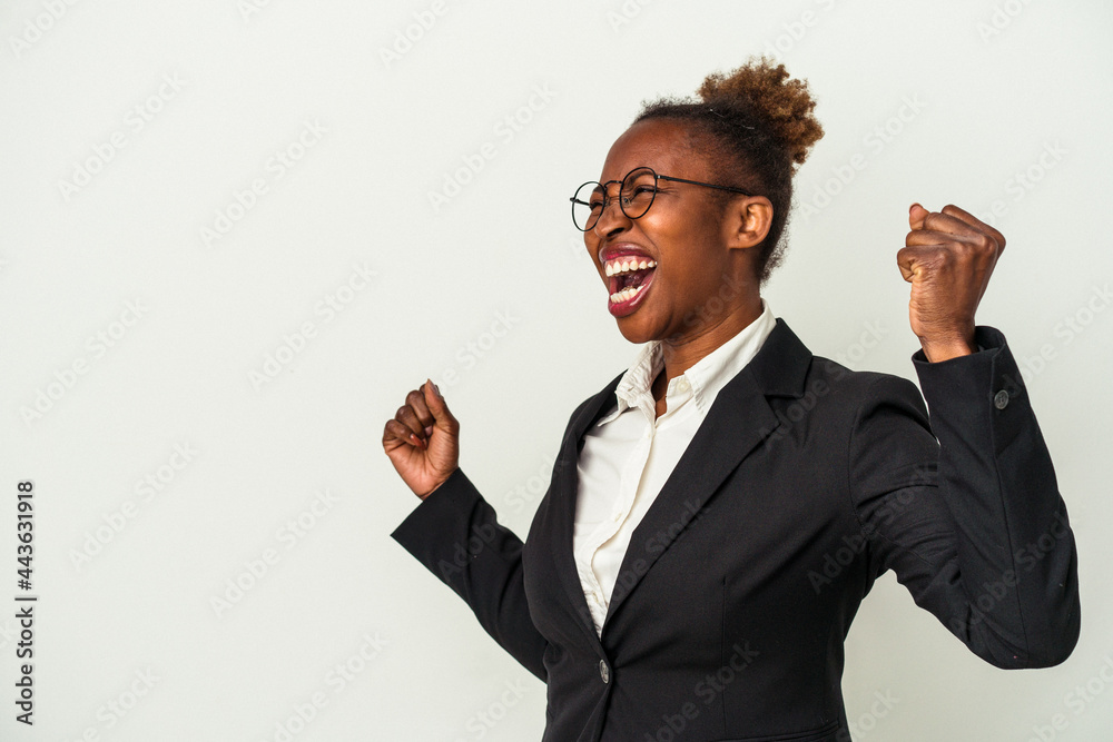 Young business african american woman isolated on white background raising fist after a victory, winner concept.
