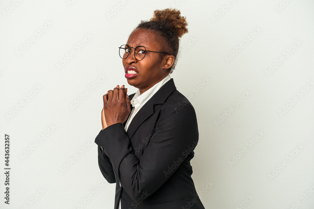 Young business african american woman isolated on white background scared and afraid. Young business african american woman isolated on white background scared and afraid.