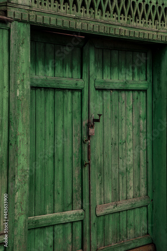 Old green wooden doors outdoors