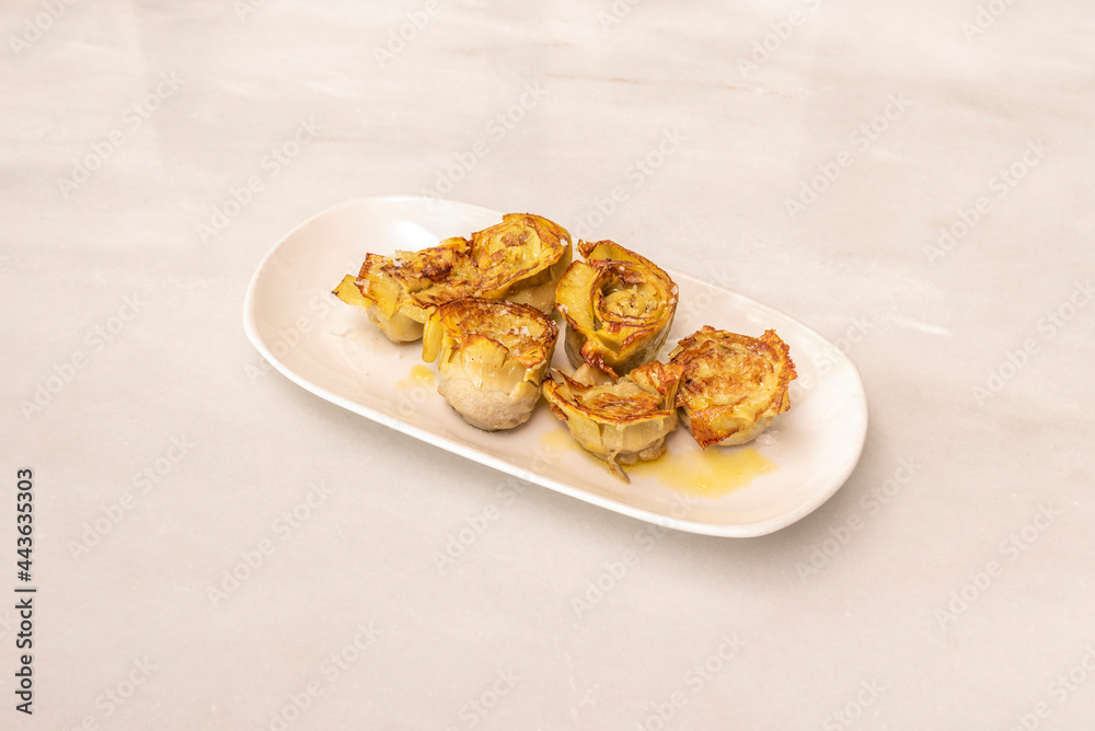 Grilled fried artichoke hearts with hints of olive oil and drizzled with coarse salt.