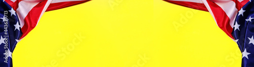 Panorama banner flag of United States America on a yellow background.