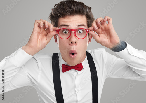 Foto Funny geek in glasses looking at camera