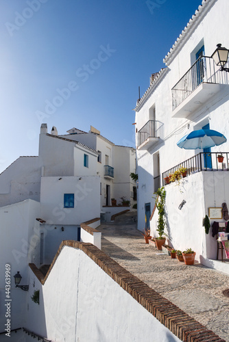 Beautiful Frigiliana village in southern Spain. Traditional Spanish mountain town. Whitewashed town houses in the old Moorish quarter. Vertical shot.