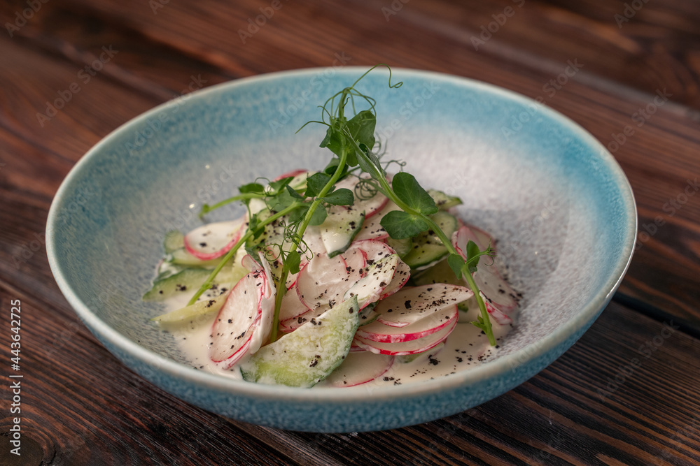 Fresh beautiful salad with cucumbers, radishes and green beans Fresh beautiful salad with cucumbers, radishes and green beans