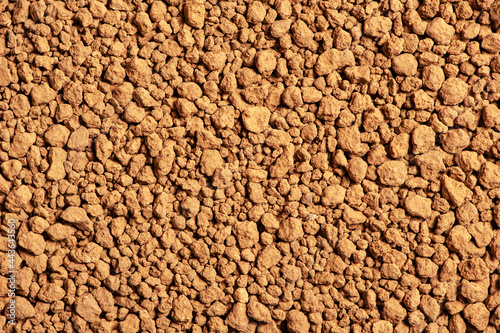 Brown soil background. Special bonsai soil texture, macro. Quality bonsai sand.