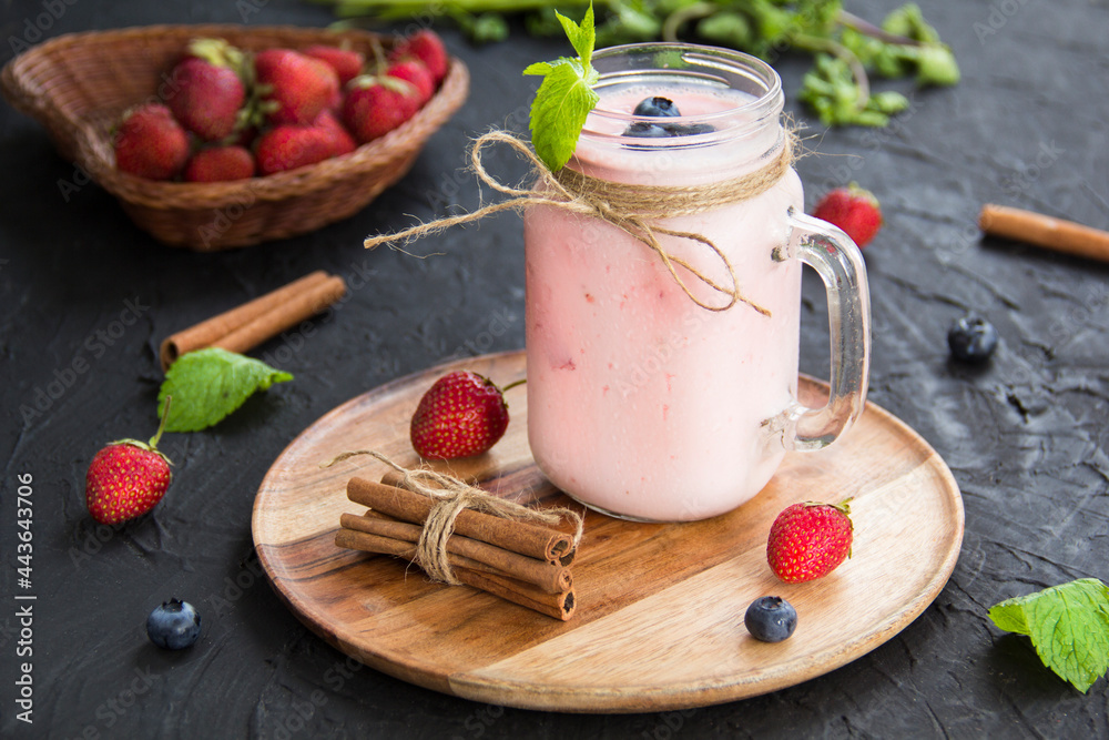 Healthy smoothie of fresh summer berries. Creative atmospheric decorationм