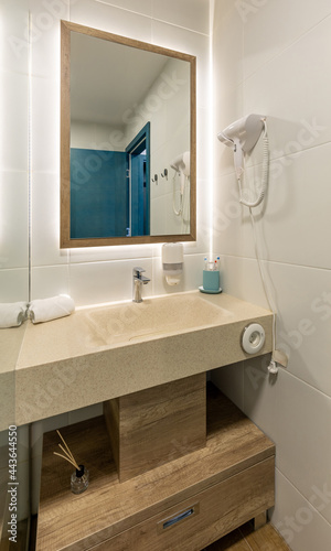 Interior of a hotel bathroom with a shower cabin