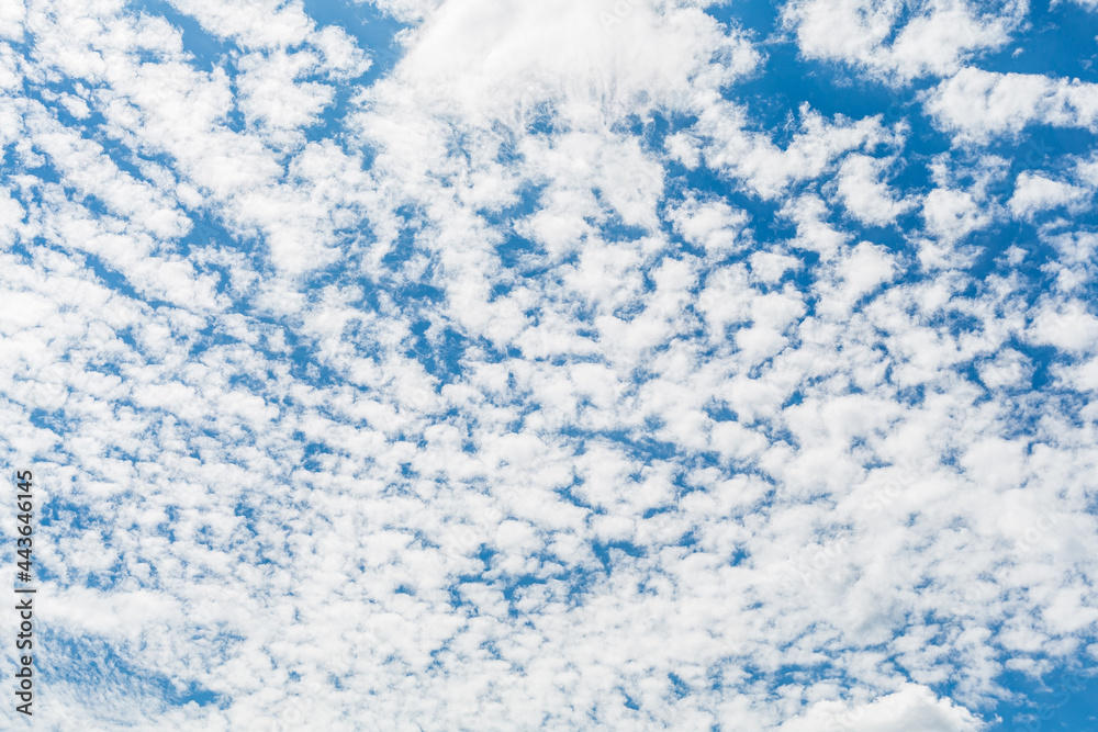 Blue sky with clouds and sun. filling the frame