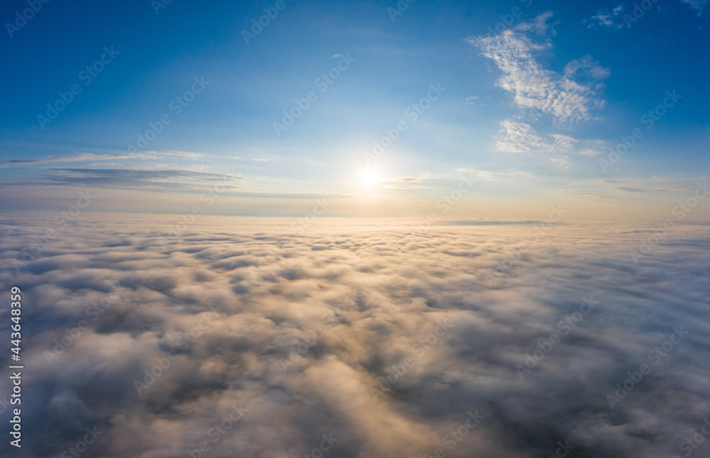 Sunrise over the clouds view from the drone