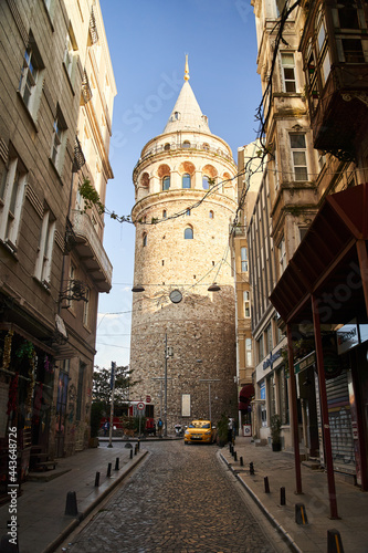 Istanbul, Turkey - May 2, 2021: View of the Galata Tower through the street.
