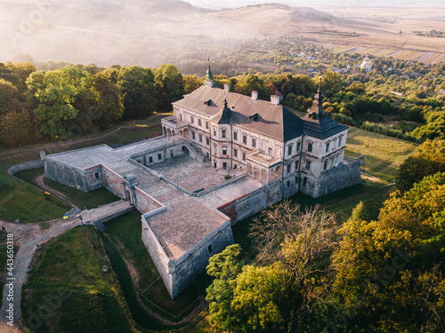 Aerial view of ancient castle at sunset. Pidhirtsi Castle in the western part of Ukraine. photo