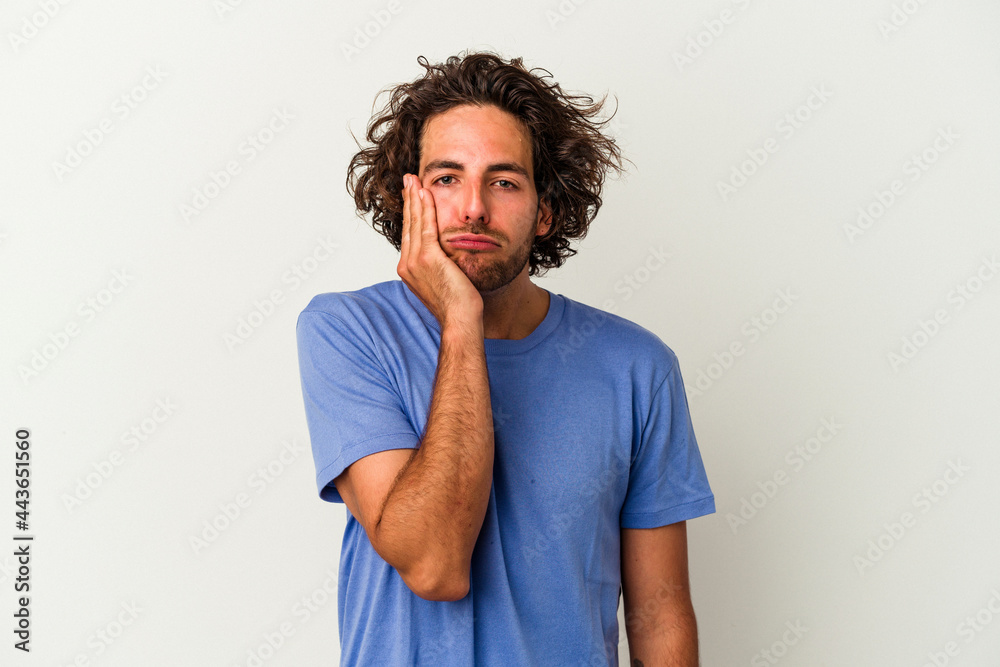 Young caucasian man isolated on white background who feels sad and pensive, looking at copy space. Young caucasian man isolated on white background who feels sad and pensive, looking at copy space.