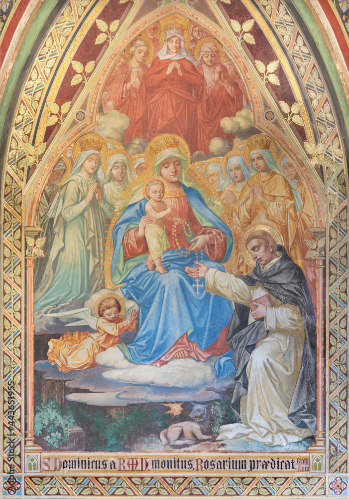 VIENNA, AUSTIRA - JUNI 17, 2021: The fresco of  Madonna presenting the Rosary to st. Dominic the Votivkirche church by brothers Carl and Franz Jobst (sc. half of 19. cent.).