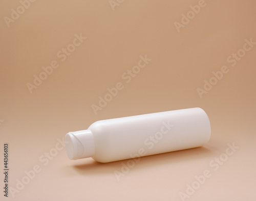 Natural beauty cosmetic bottles white mockup cosmetic product for skin care on beige background. Levitation cosmetic white lotion bottles.