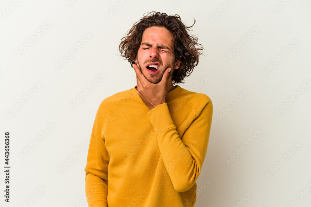 Young caucasian man isolated on white background having a strong teeth pain, molar ache. Young caucasian man isolated on white background having a strong teeth pain, molar ache.