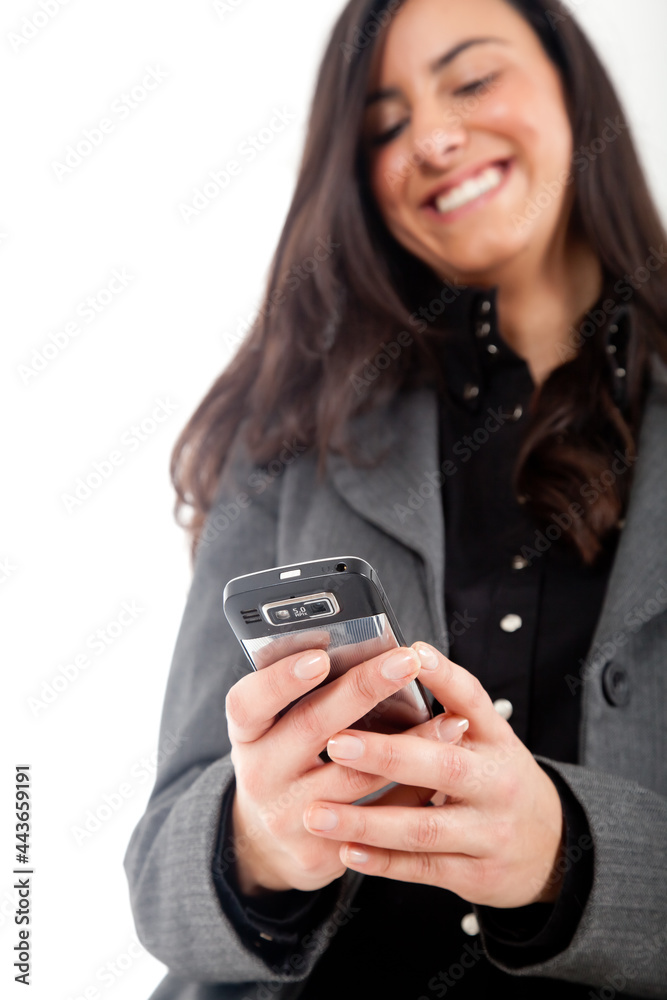 Young woman using a smartphone isolated on white Young woman using a smartphone isolated on white