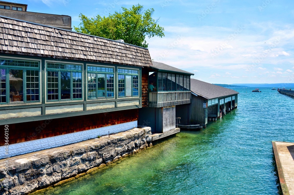 Waterfront buildings, restaurant and boathouses, on the  the Skaneateles Lake. It’s one of Finger Lakes in New York. 