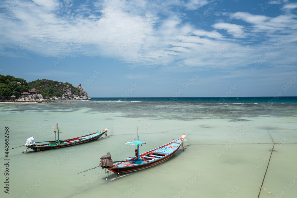Long Tail Boats Tied Up In Shallow Water on Sairee Beach, Koh Tao, Thailand