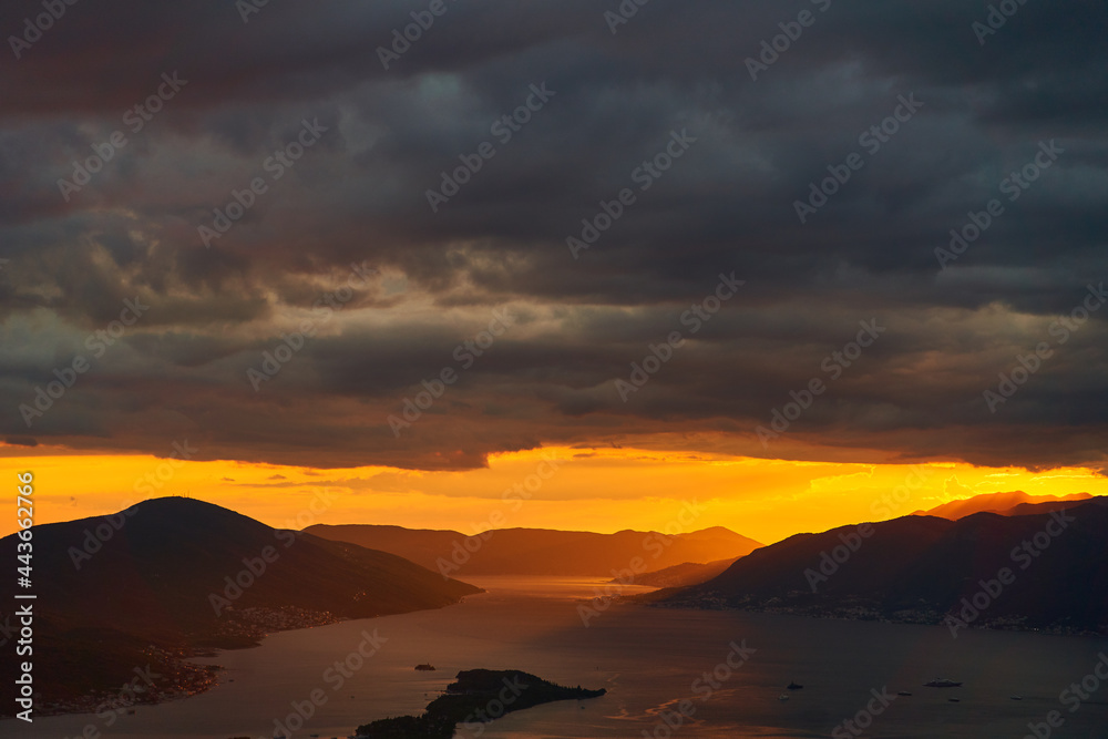 Obraz premium View of the Tivat Bay and the airport runway. Sunset in the Tivat Bay