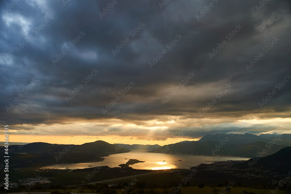Obraz premium View of the Tivat Bay and the airport runway. Sunset in the Tivat Bay